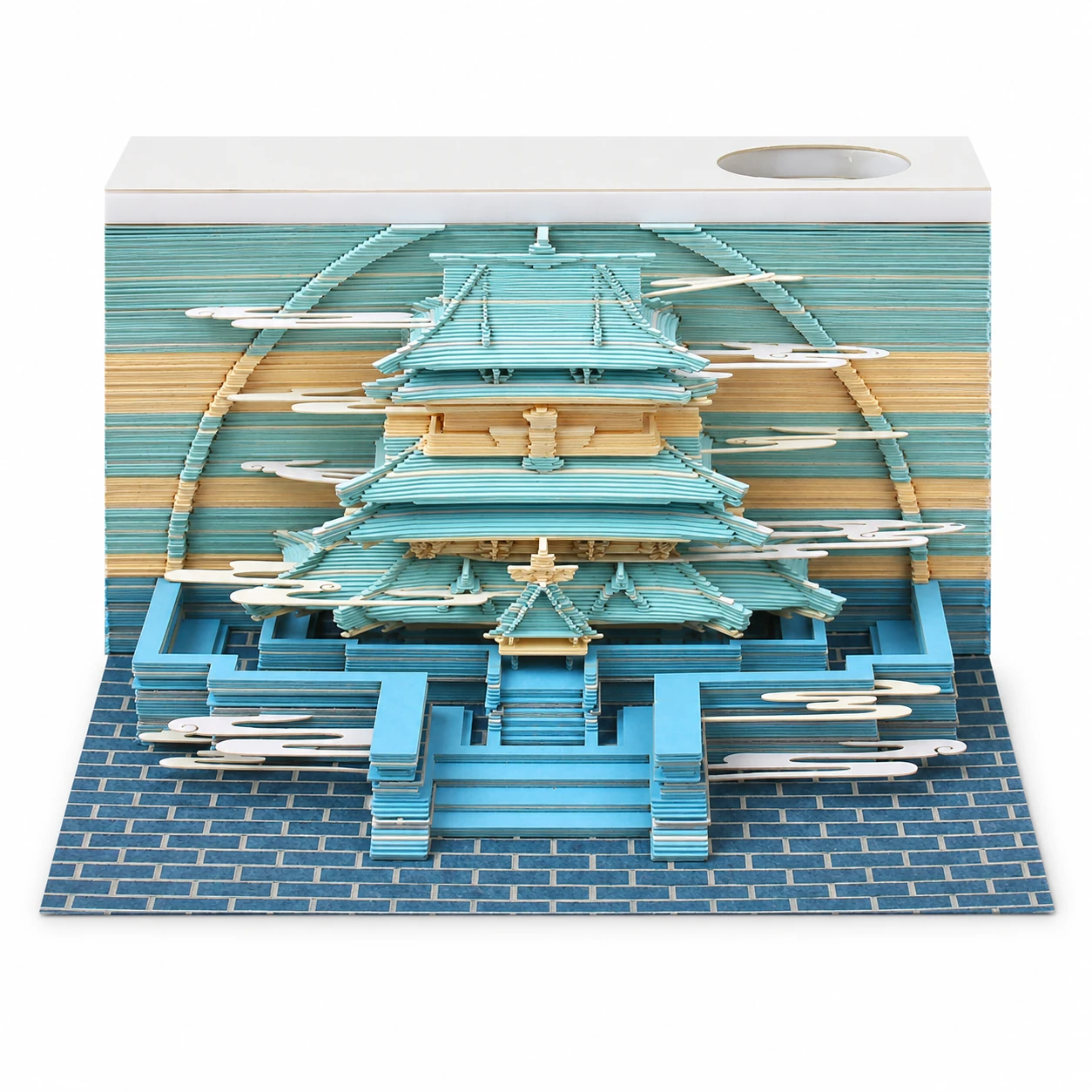 Fully revealed paper sculpture of a celestial palace on its display base