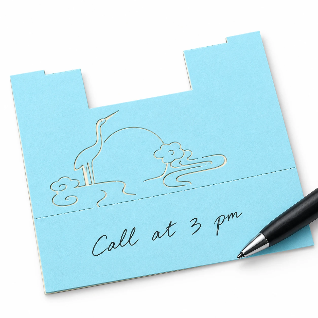Single memo sheet with engraved cloud and crane artwork and a handwritten note